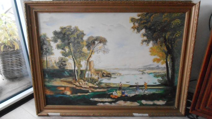 Landschap met bomen, water en bootjes in een gouden lijst.